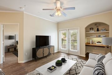 Seguin apartment for rent - A living room with a white couch and a flat screen TV.